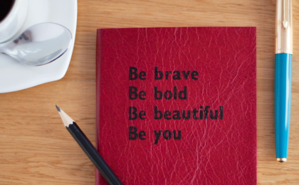 quotes notebook pen pencil and coffee cup