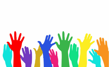 multicoloured hands up in the air