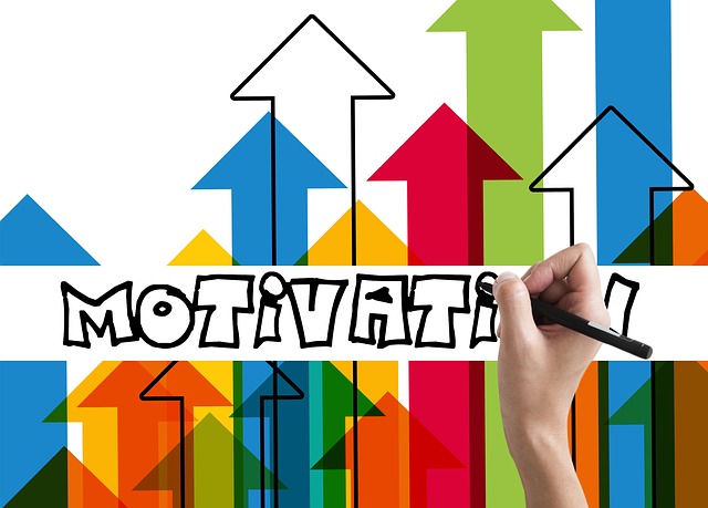 multi-coloured arrows with a hand writing motivation on top of them 