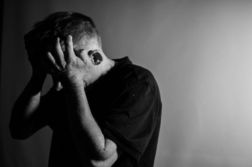 man with his head in his hands
