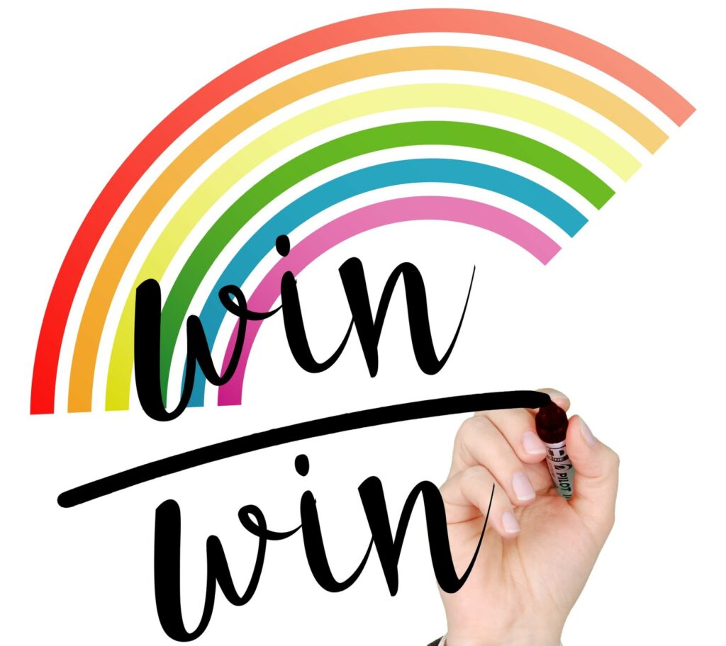 rainbow with a hand writing the words win win