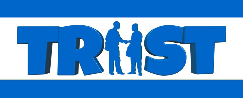 blue sign of word trust with 2 people signifying the u letter