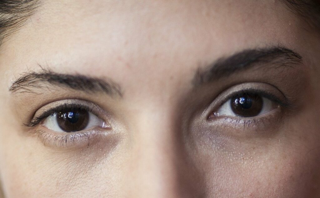 engaging and interacting closeup of brown eyes