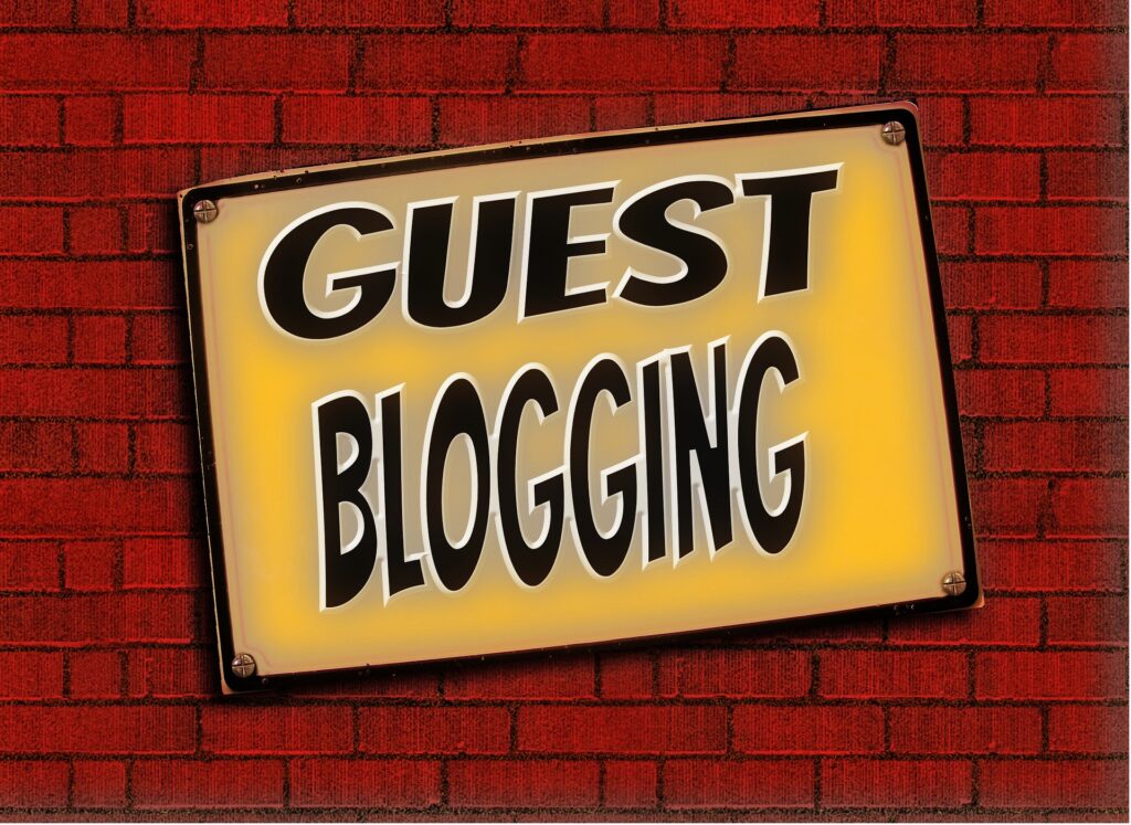 guest blogging sign on brick wall