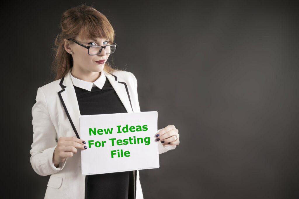 woman wearing glasses holding a new ideas for testing file of 5 simple tweaks to increase your profits