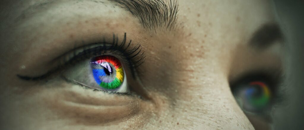close up of multi-coloured eyes reading how to use colours on your website to get more clicks blog