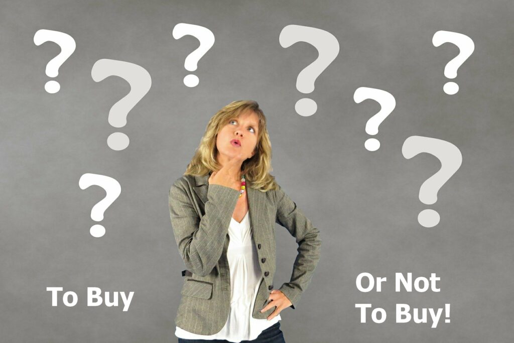 woman looking up surrounded by question marks thinking about how to use colours on her website to get more clicks