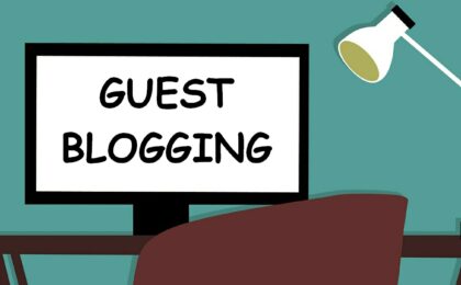 illustration of desk, lamp and laptop with guest blogging written on screen
