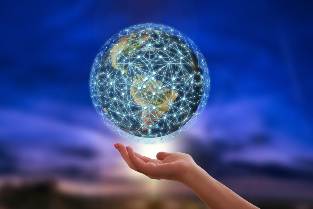 globe suspended above a person's hand