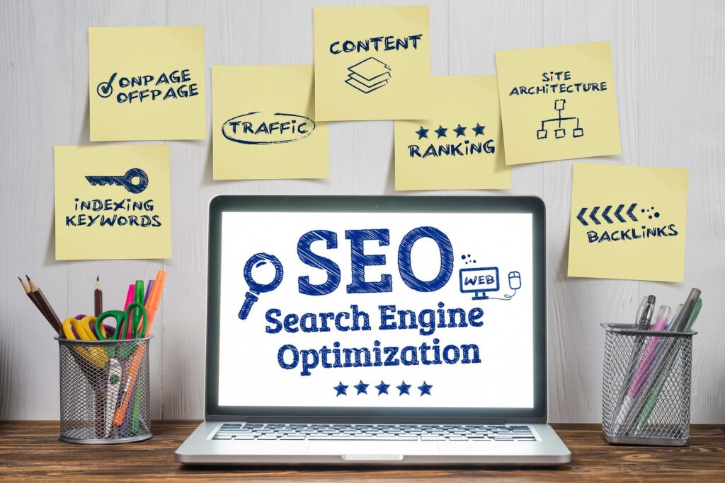 seo displayed on laptop with post it notes surrounding it related to the role of title tags in website ranking