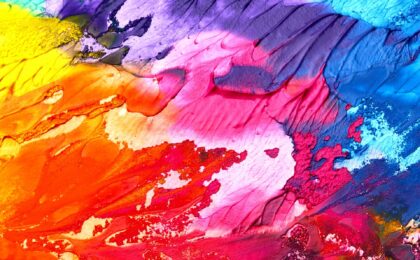 a mix of colourful paints featured image for how to use colours on your website blog post
