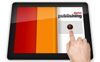 course content distribution and syndication featured image. Finger pushing button on a tablet screen that says digital publishing.
